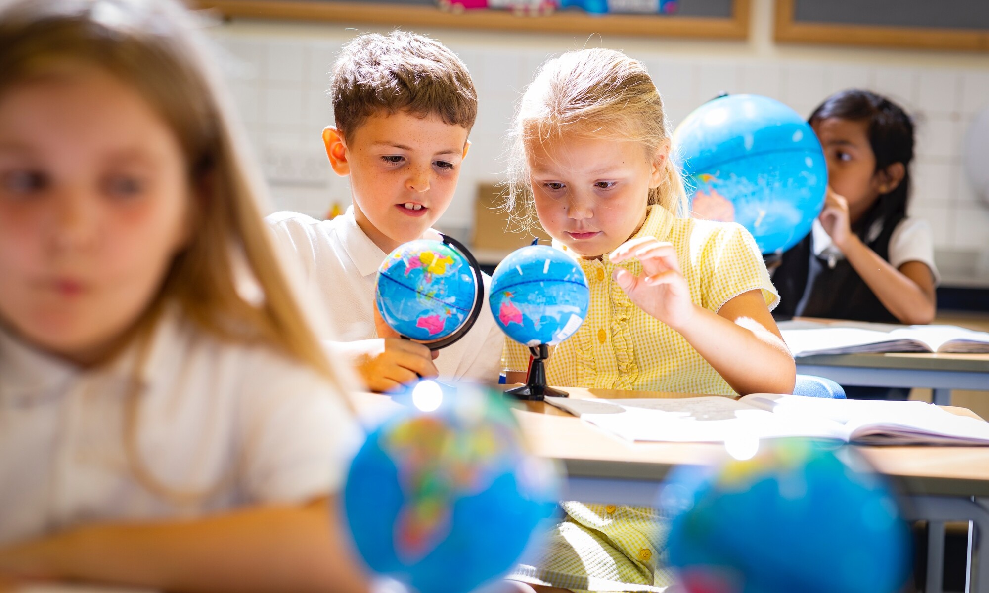 White House Academy Image of Two Students Using a Globe in Geography Lesson